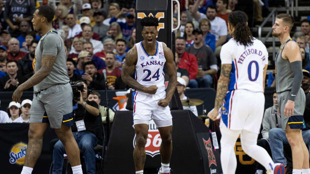 Mar 9, 2023; Kansas City, MO, USA; Kansas Jayhawks forward KJ Adams Jr. (24) celebrates after a play against the West Virginia Mountaineers in the first half at T-Mobile Center.